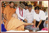 Swamishri performs pujan of foundation bricks for the BAPS mandir in Than