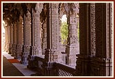 A corridor of ornate pillars 