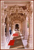 A corridor of ornate pillars 