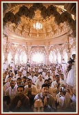 Leading devotees participating in the murti-pratishtha rituals held beneath the main dome 