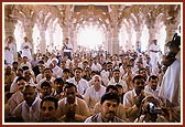 Leading devotees participating in the murti-pratishtha rituals held beneath the main dome 