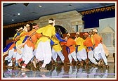 Satsangi tribal children perform a traditional dance
