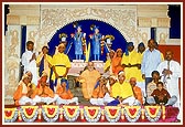 Swamishri with tribal children who performed a welcome dance