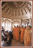 Swamishri initiates infants into Satsang