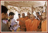 Swamishri initiates infants into Satsang