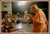 After his morning puja Swamishri performs arti of Thakorji in celebration of the Rath Yatra festival