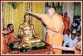 Swamishri performs the first abhishek with panchamrut