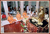 Pujya Ishwarcharan Swami, Pujya Viveksagar Swami and Pujya Satsangijivan Swami engaged in mahapuja rituals as part of the murti-pratishtha ceremony