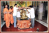 Youths perform abhishek