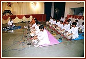 Members of BAPS bal mandal, Amdavad, give a tabla performance in Swamishri's morning puja