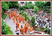 Sadhus and Swamishri perform pradakshina of mandir 
