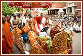Sadhus and Swamishri perform pradakshina of mandir 