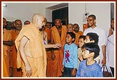 Swamishri blesses four kids who performed 84 hr. fast by drinking only water to please Swamishri