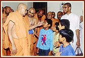 Swamishri blesses four kids who performed 84 hr. fast by drinking only water to please Swamishri
