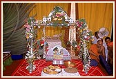 Shri Harikrishna Maharaj in a decorated cradle