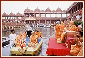 Senior sadhus take Shri Harikrishna Maharaj and Shri Ganeshji for a boat ride