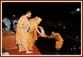 At the end of festival Swamishri ritually performs the immersion ceremony of Shri Ganapatiji