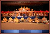 Sadhus present a kirtan aradhna in the assembly