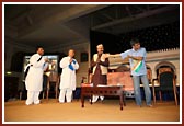 Youths performs a drama on Satsang Shikshan Pariksha Din