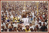 A devotee devotionally dances during a kirtan