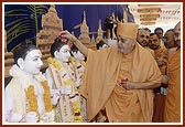 Swamishri performs puja of Shri Ghanshyam Maharaj, Shri Ganeshji, Shri Hanumanji and other 11 new hari mandirs