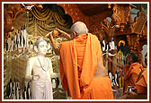 Senior sadhus perform abhishek rituals of the murtis on the occasion of the patotsav 