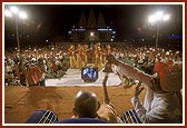 Swamishri participates in the program by ringing a bell