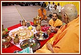 ... ceremoniously bathes the deities (snanam)