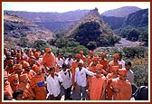 A guide explaining the history of the Ajanta caves